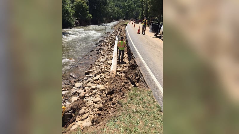 AUGUST 18, 2021 - Cruso was hit hard with record flooding on the Pigeon River from Tropical Storm Fred. Wednesday afternoon, only local traffic was allowed on US-276 into Cruso. Pictured: Crews work as a power pole was downed and the bank can be seen broken away from the road. (Photo credit: NCDOT)