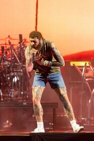 Rapper Post Malone performs during his “If Y'all Weren't Here, I'd Be Crying Tour" at PNC Music Pavilion in Charlotte on July 29, 2023.