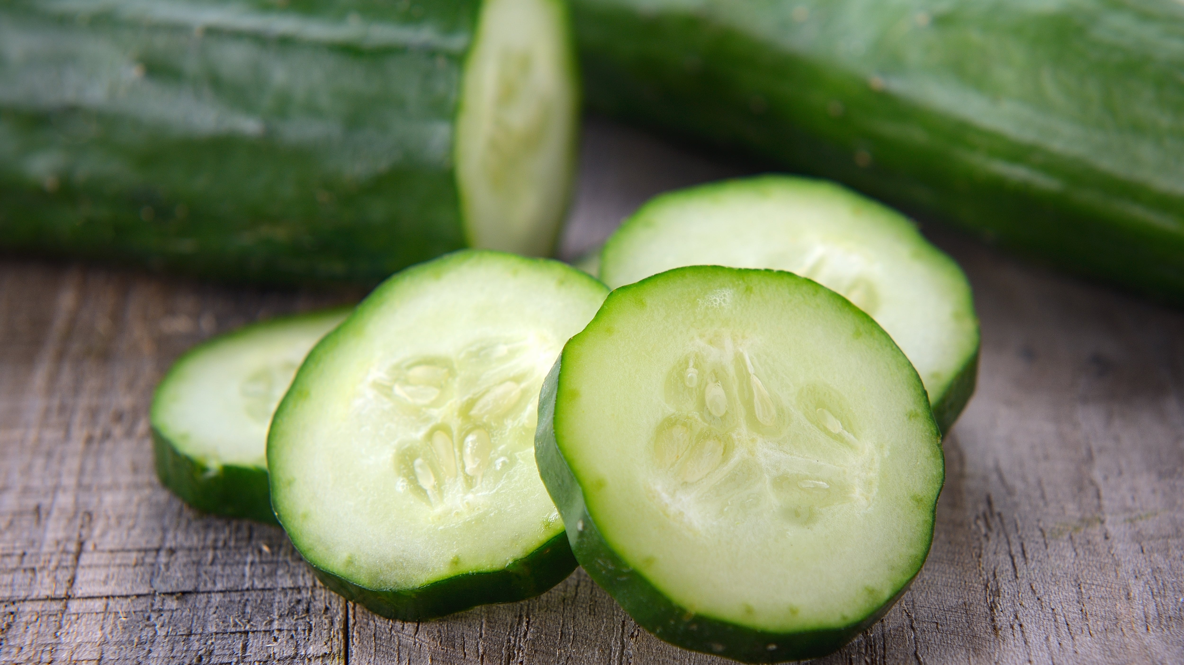 Cucumbers on a table or cutting board.