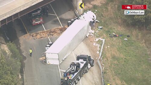 Chopper 9 Skyzoom shows debris and leftover fuel spill after crash on ramp from I-485 to I-77.