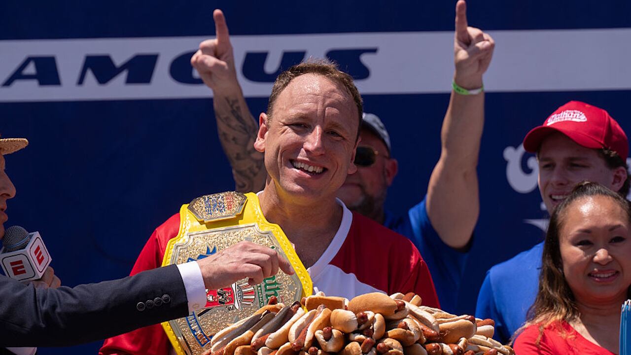 Joey Chestnut exults after winning the mustard belt for the 17th time.