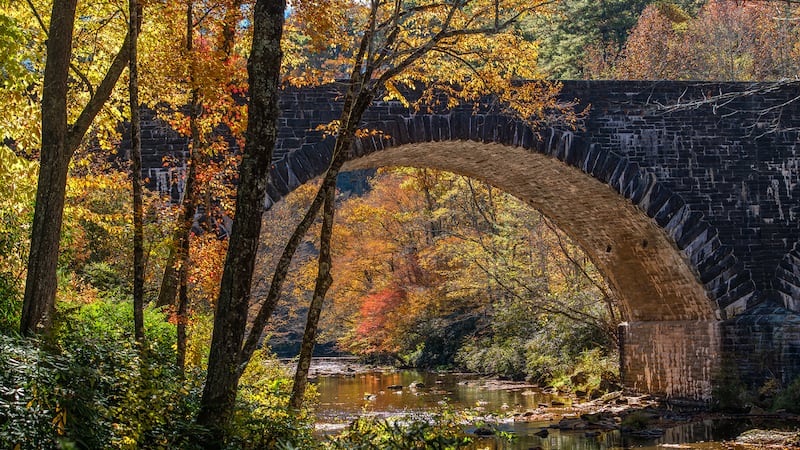 Oct. 25, 2023: Fall color and sunlight illuminate this iconic bridge along the Blue Ridge Parkway in this photo taken near the Linville Falls Picnic Area, at Milepost 316.5. The great weather this week provides ideal conditions for a scenic autumn drive. Heading south along the Blue Ridge Parkway from the Grandfather Mountain area still provides a nice look at fall foliage. Routes into the High Country from lower elevations, such as U.S. 321 between Lenoir and Blowing Rock, N.C. 181 between Morganton and Pineola and U.S. 221 between Marion and Linville, are also currently offering picturesque views.