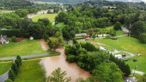 AUGUST 18, 2021 - Pigeon River, bridge washed out and road underwater in the Beaverdam Community in Canton. (Photo credit: Suzie Pressley)