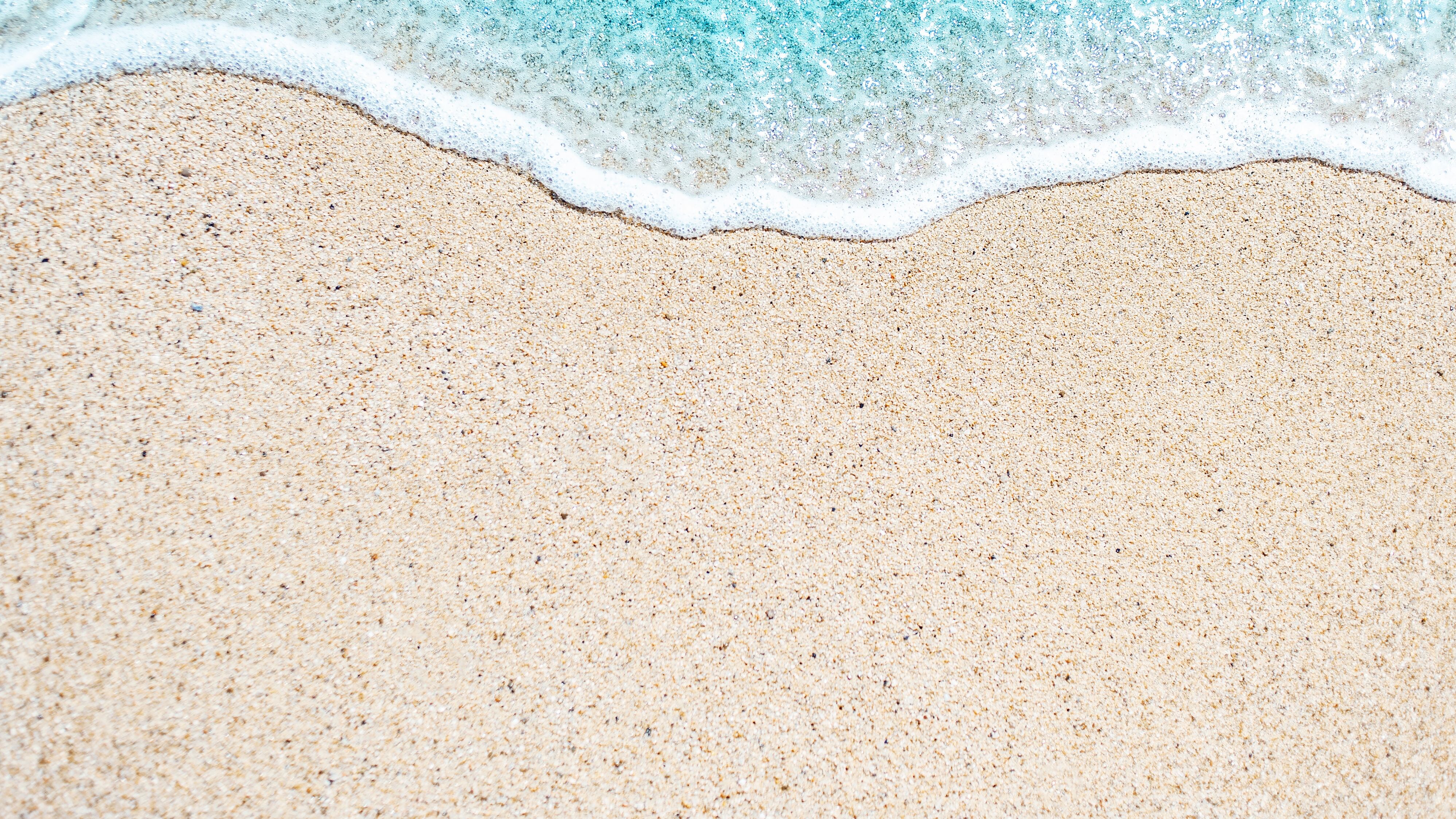 A woman sunk into the sand at a beach last weekend near Phippsburg, Maine.