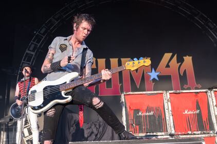Sum 41 perform during the “Let The Bad Times Roll” tour at PNC Music Pavilion in Charlotte on Aug. 18, 2023.
