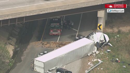 Chopper 9 Skyzoom shows debris and leftover fuel spill after crash on ramp from I-485 to I-77.