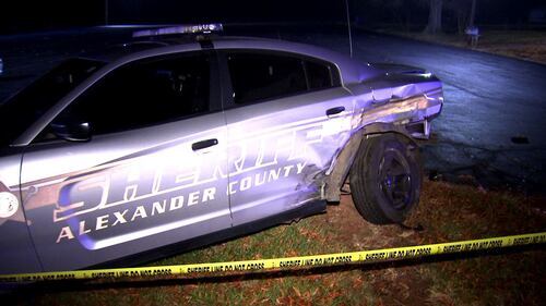 Dozens of police officers and deputies responded after a deputy was hit and injured by a stolen patrol car in Alexander County on Friday, Dec. 17, 2021.
