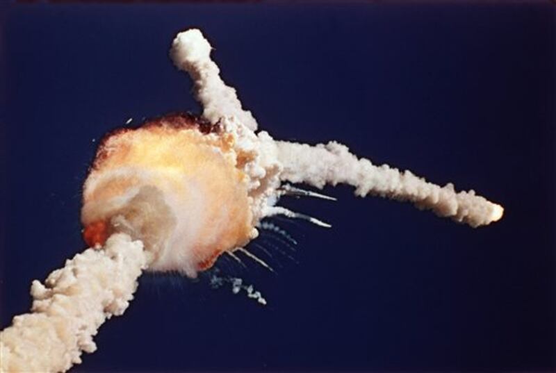 FILE - In this Jan. 28, 1986 file photo, the Space Shuttle Challenger explodes shortly after lifting off from Kennedy Space Center, in Fla. All seven crew members died in the explosion, which was blamed on faulty o-rings in the shuttle's booster rockets. Bob Ebeling had spent three decades filled with guilt over not stopping the explosion of Challenger, but found relief in the weeks before his death Monday, March 21, 2016, at age 89. NPR reports Ebeling had been a booster rocket engineer at a NASA contractor during the launch. He tried to convince them to postpone it, saying the cold temperatures could cause the shuttle to explode. (AP Photo/Bruce Weaver, File)