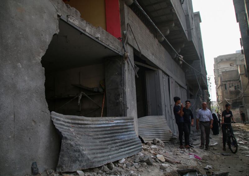 GAZA CITY, GAZA - OCTOBER 08: Palestinian citizens inspect damage to their homes caused by Israeli airstrikes on October 08, 2023 in Gaza City, Gaza. After the attack launched by Hamas on Israel yesterday, which surprised them, Israeli Prime Minister Benjamin Netanyahu asked the Palestinians to leave Gaza, and warned that the army would turn Hamas positions “into rubble.” (Photo by Ahmad Hasaballah/Getty Images)