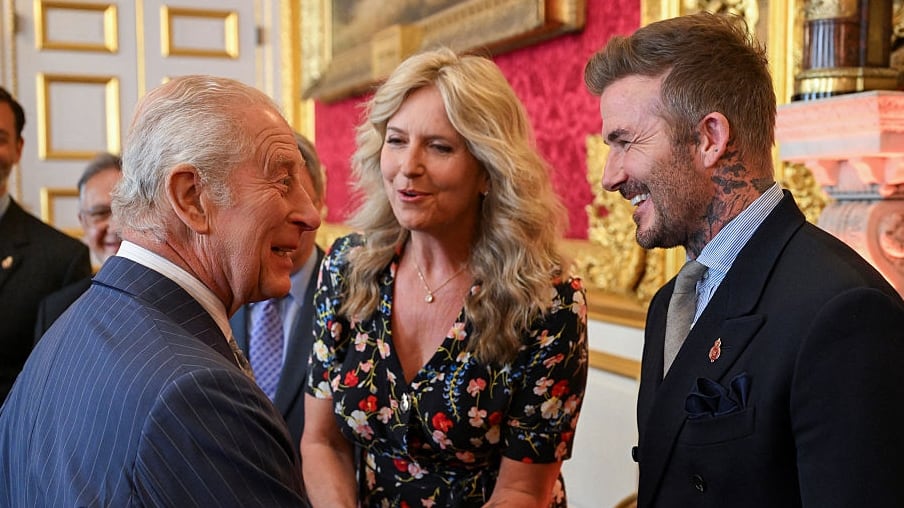 King Charles greeting David Beckham