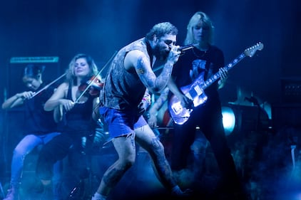 Rapper Post Malone performs during his “If Y'all Weren't Here, I'd Be Crying Tour" at PNC Music Pavilion in Charlotte on July 29, 2023.