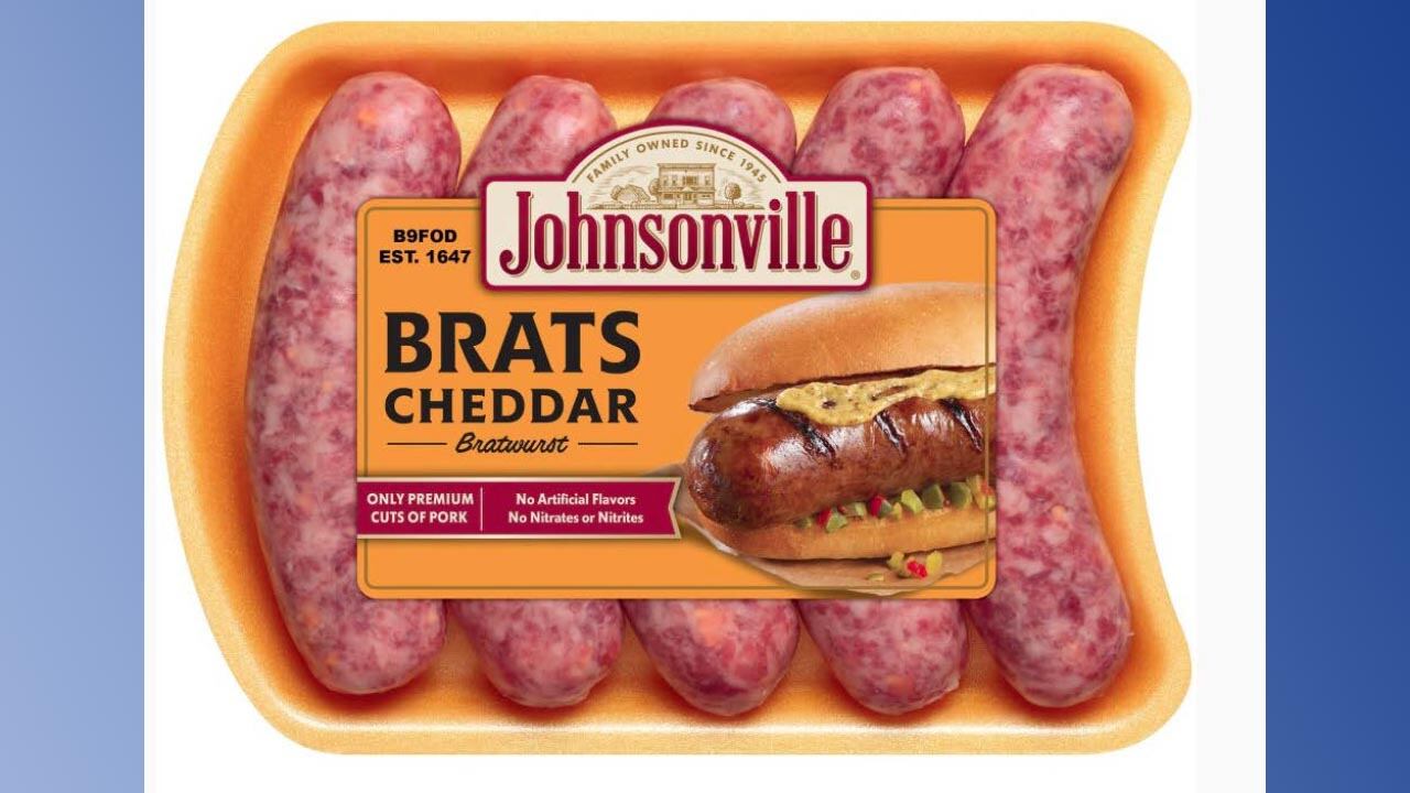A tray of Johnsonville cheddar bratwursts.