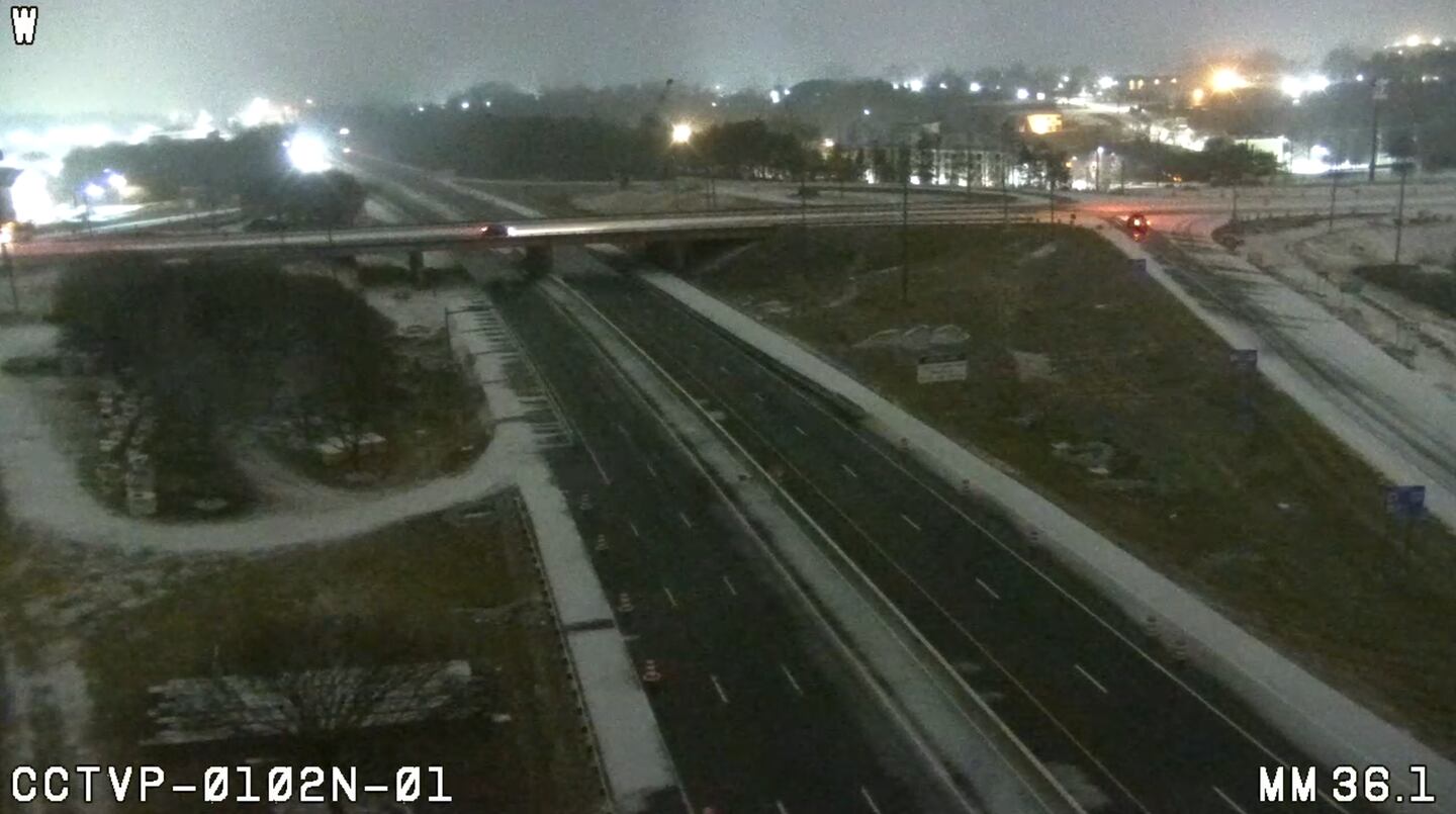 Sleet on the side of I-77 just before 11 p.m. on Jan. 24, 2026