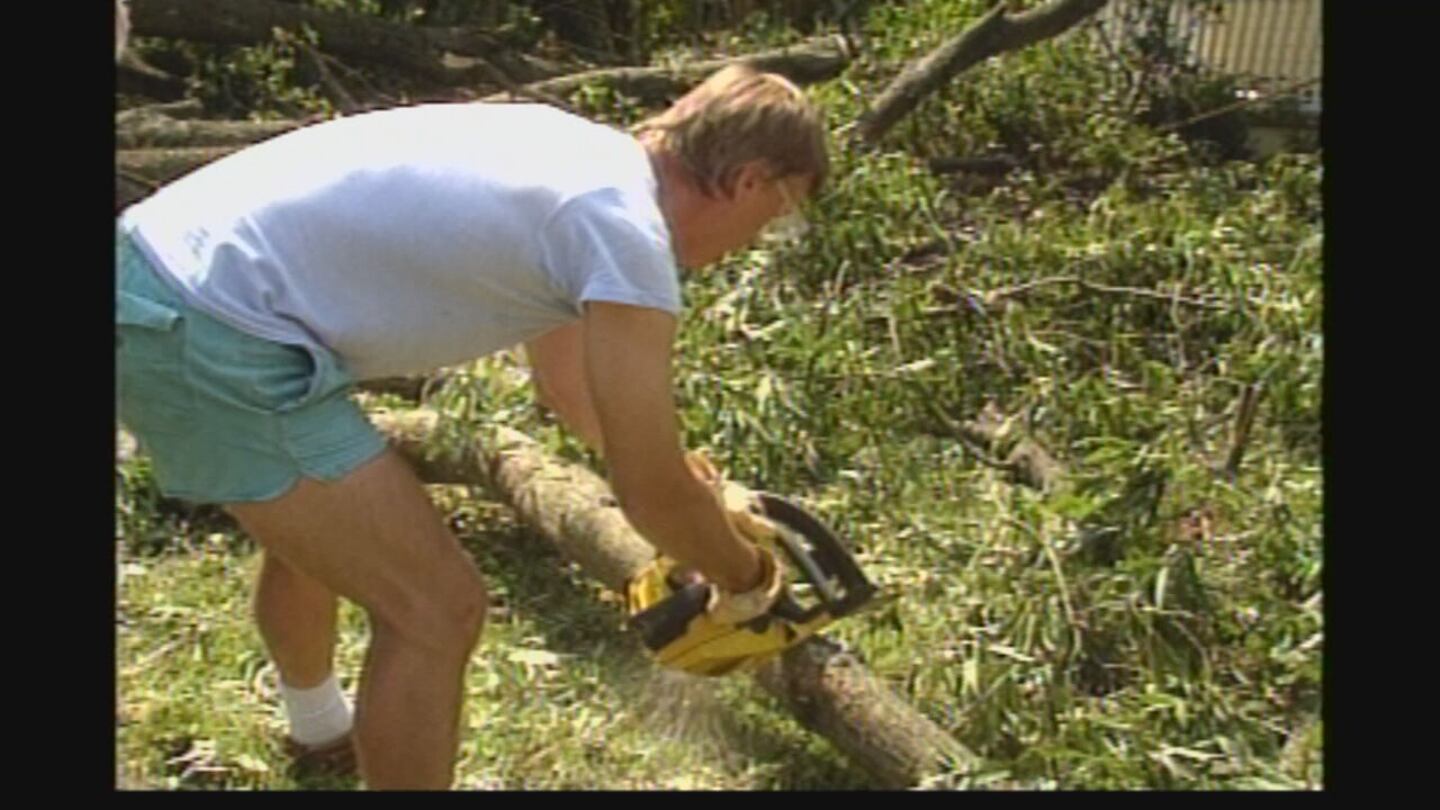 Neighbors help cut broken trees after Hurricane Hugo