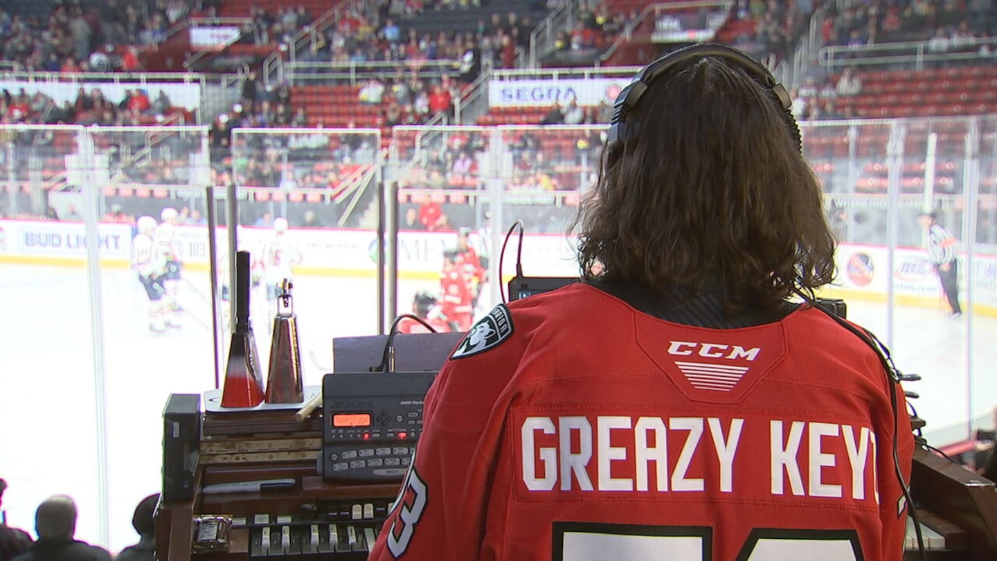 Charlotte musician Jason Atkins sits behind the organ at a Charlotte Checkers game.