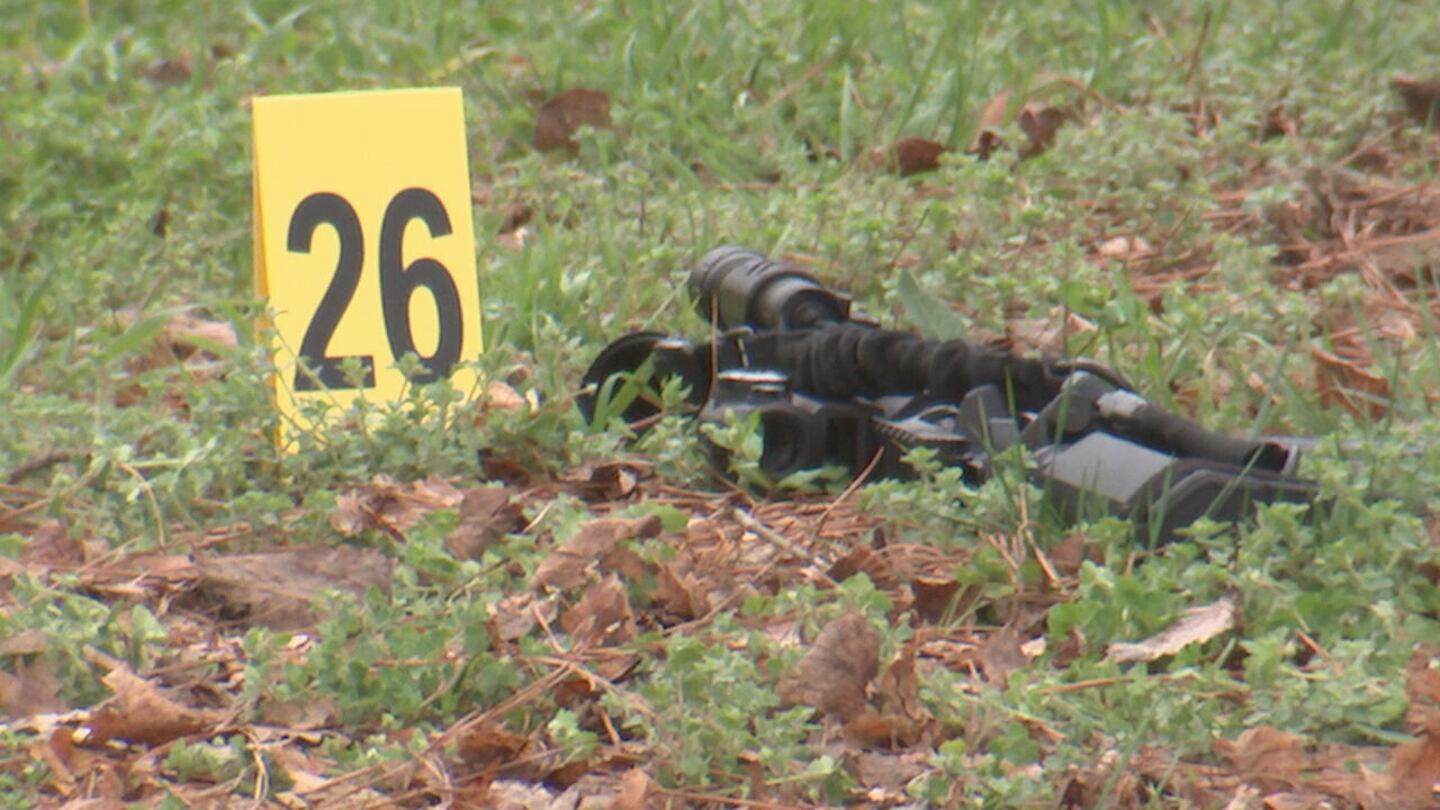 It appears to be a gun on the ground and 26 crime scene markers outside the Salisbury home where the shooting happened.