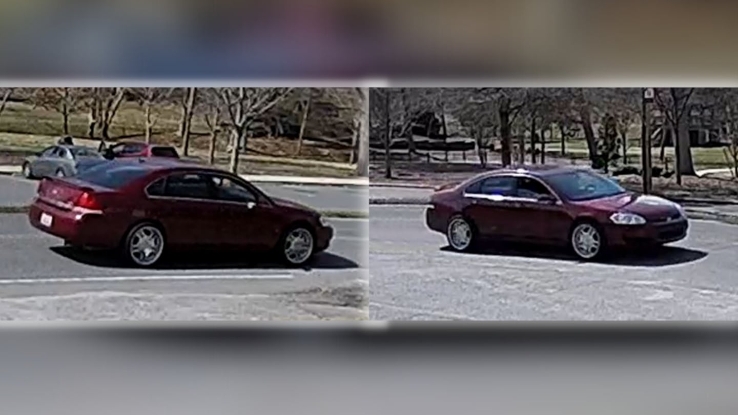 Surveillance photos show the suspect driving a burgundy-colored four-door Chevrolet.