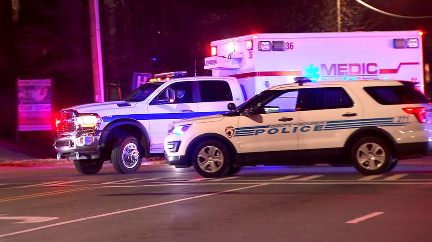 CMPD cruisers escort an ambulance to the hospital following a crash on I-85 in northeast Charlotte on Wednesday, Dec. 22, 2021.