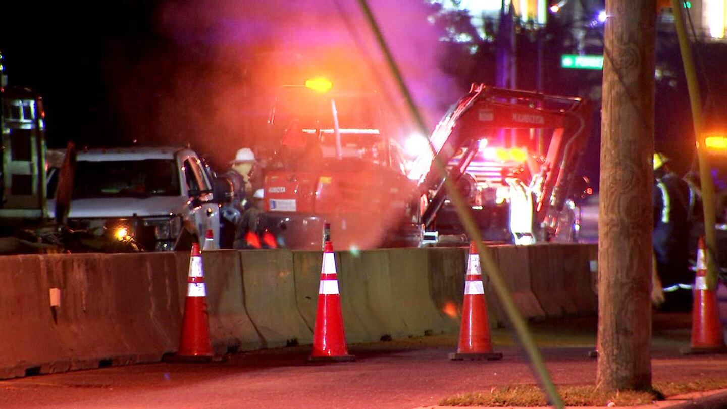 Crews work to repair a cut natural gas line on South Boulevard.