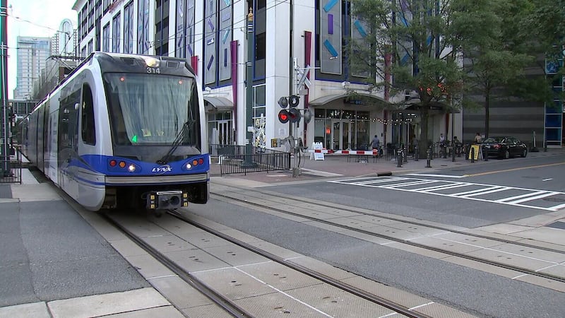 Video appears to show man holding knife while arguing with passengers on light rail
