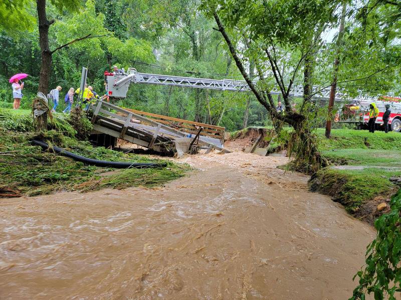 AUGUST 17, 2021 - Canton & Haywood Fire & Rescue help a school bus of kids after heavy floodwaters from Tropical Depression Fred knocked out a bridge. (Photo credit: Benjamin Timmermans)