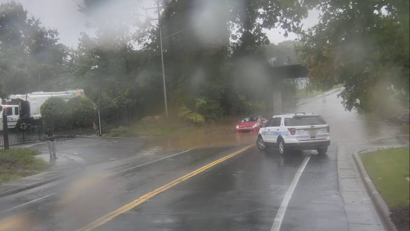 Car gets stuck in water on Hawthorne Lane